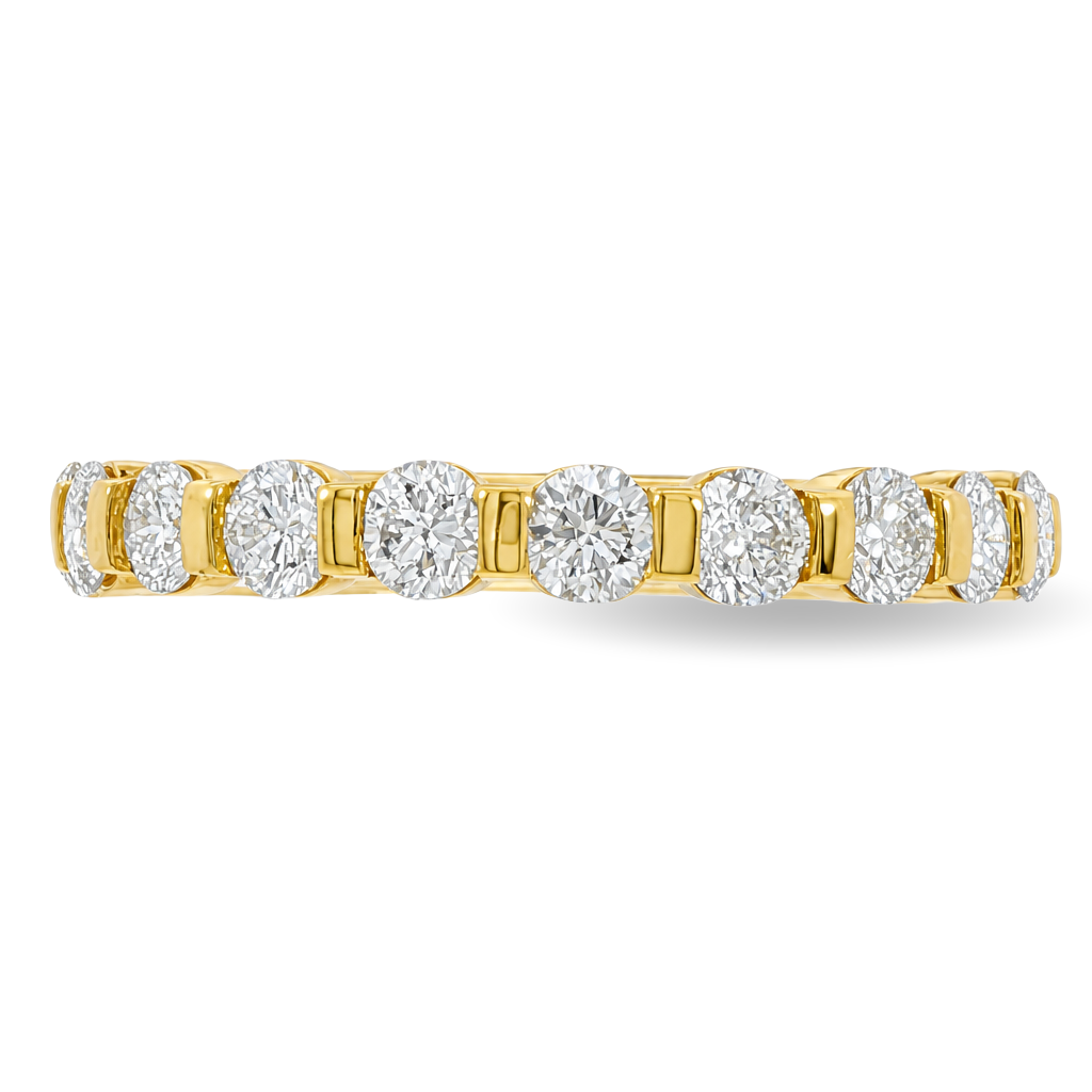 A yellow gold band featuring round brilliant-cut diamonds set in a continuous band, shown against a plain white background.