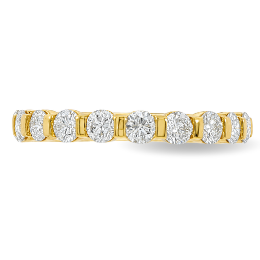 A yellow gold band featuring round brilliant-cut diamonds set in a continuous band, shown against a plain white background.