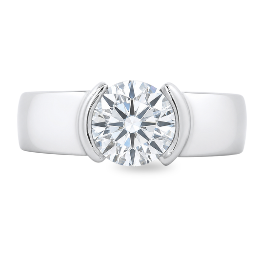 White gold solitaire ring with a thick band, with a round brilliant diamond. Set on a white background