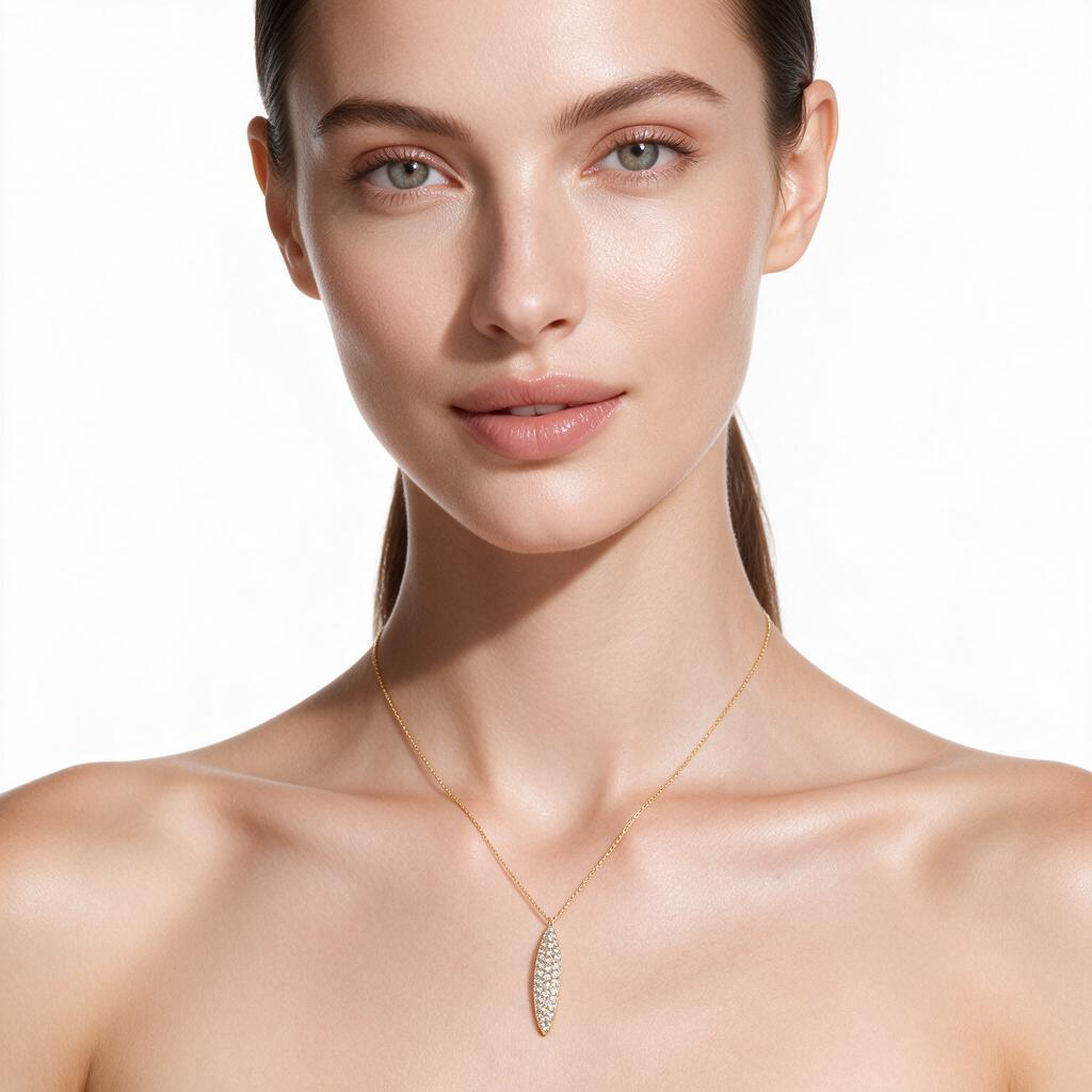 Yellow gold long bar pendant pave set with round brilliant diamonds. Shown on a female model set on a clean white background.