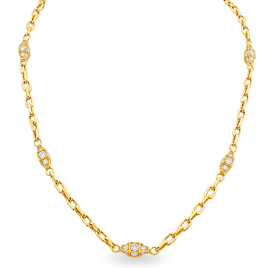 A yellow gold chain necklace featuring diamond-set decorative accents spaced along the chain, displayed on a clean white background.