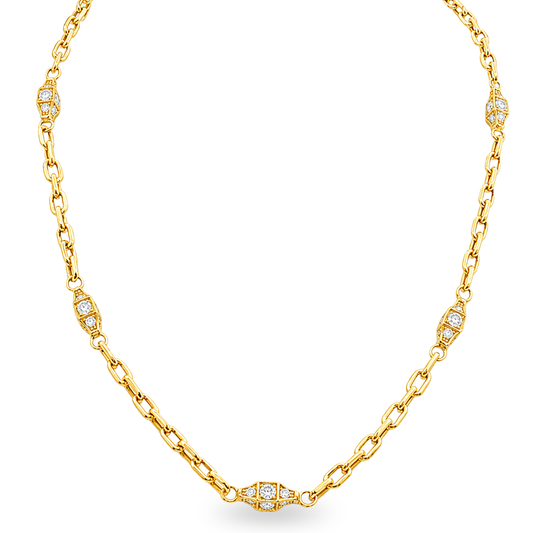 A yellow gold chain necklace featuring diamond-set decorative accents spaced along the chain, displayed on a clean white background.