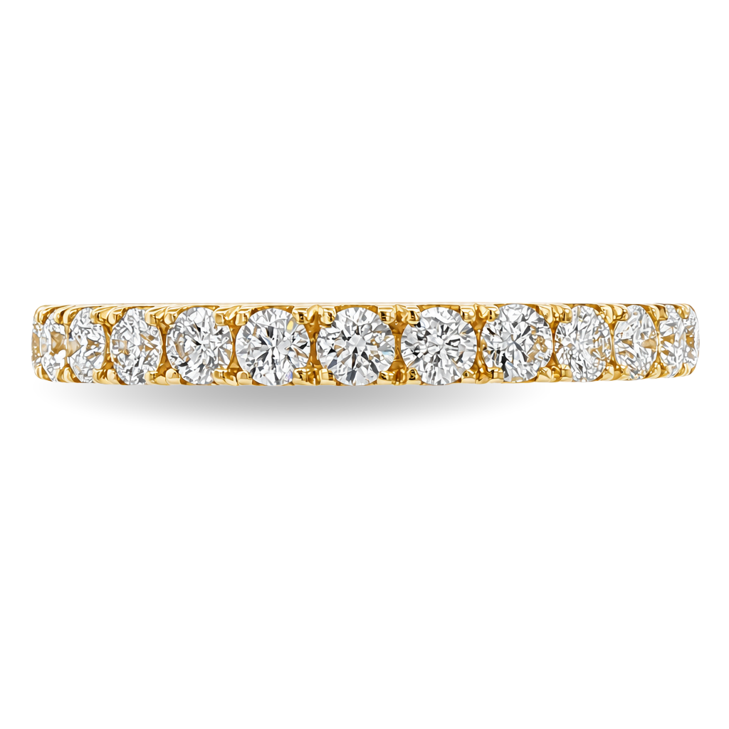 A yellow gold band featuring a continuous row of round-cut diamonds set in a prong setting, shown on a clean white background.