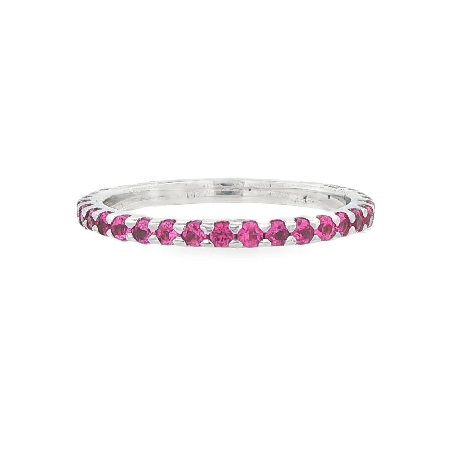 14K White gold eternity band set with pink sapphires. Item 9236 - ABC Jewelry Co.