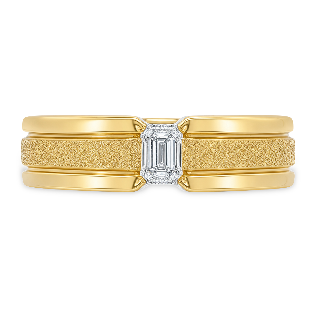 A yellow gold ring with a textured center band, a smooth outer band, and a rectangular emerald-cut diamond in the middle, shown on a plain white background.