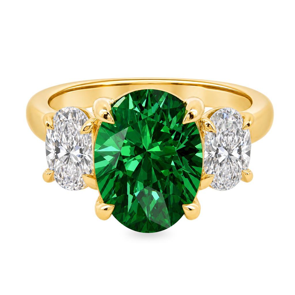 14K Yellow gold three stone ring set with an oval green emerald center accented by two oval diamonds 
