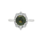 14K White gold ring set with a round green sapphire surrounded by a halo of round diamonds. Item, J31925 - ABC Jewelry Co.