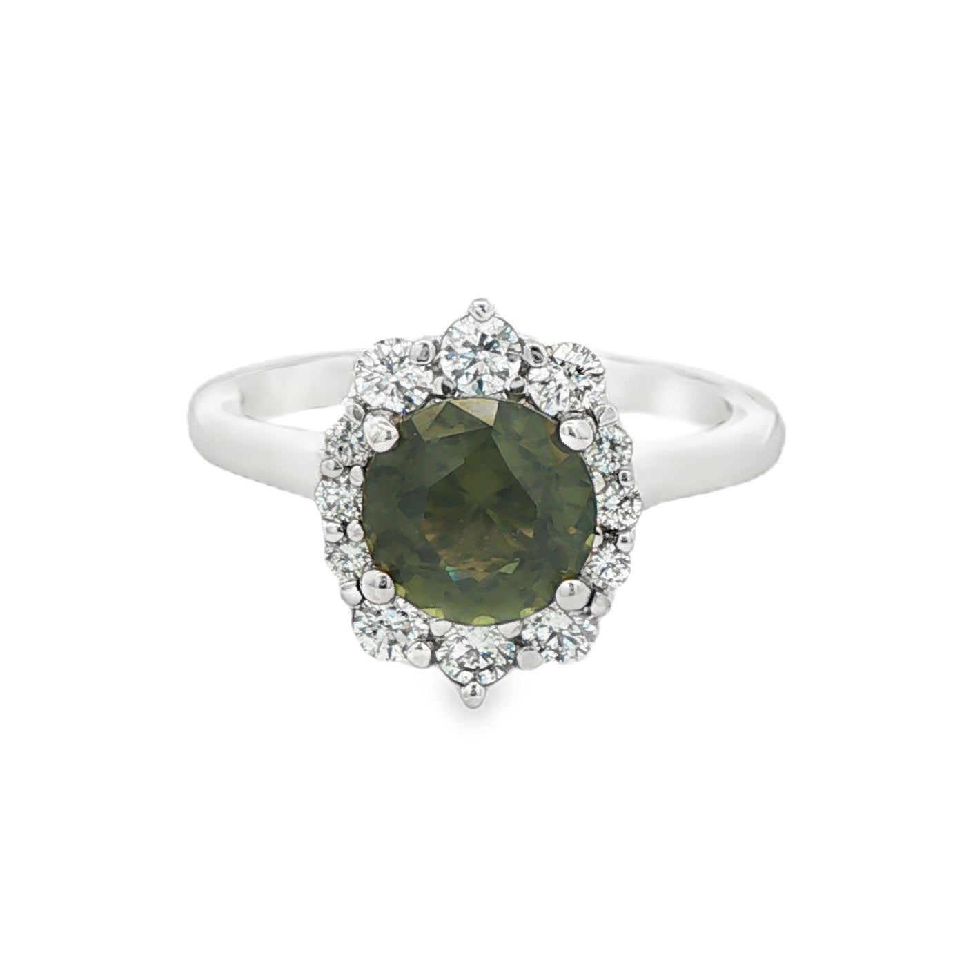 14K White gold ring set with a round green sapphire surrounded by a halo of round diamonds. Item, J31925 - ABC Jewelry Co.