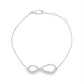 18K White gold delicate chain bracelet with diamond set infinity symbol. Item J33121 - ABC Jewelry Co