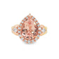 14K Rose gold ring set with a pear shape morganite surrounded with a diamond halo. Item J33283 - ABC Jewelry Co. 