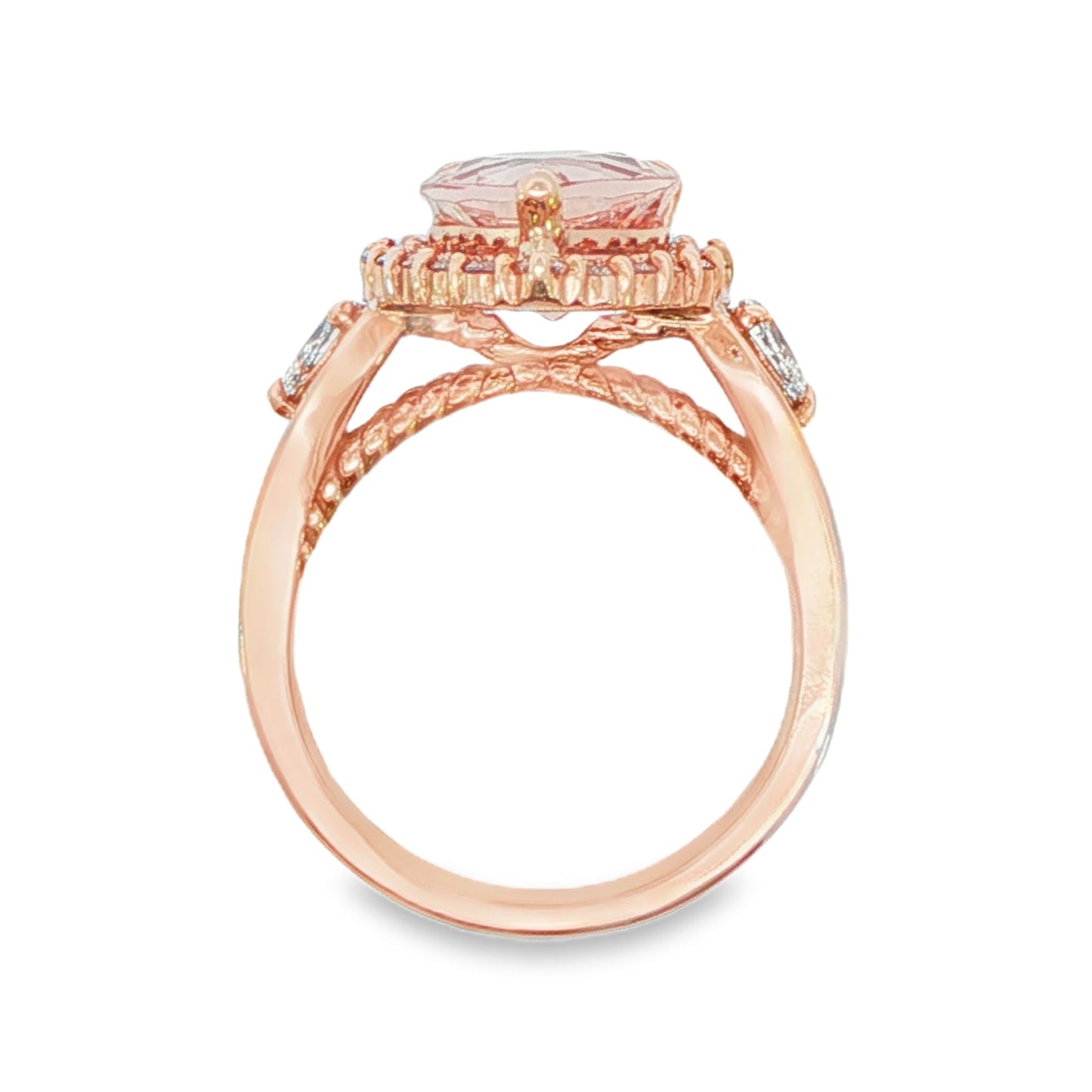 14K Rose gold ring set with a pear shape morganite surrounded with a diamond halo. Item J33283 - ABC Jewelry Co. 