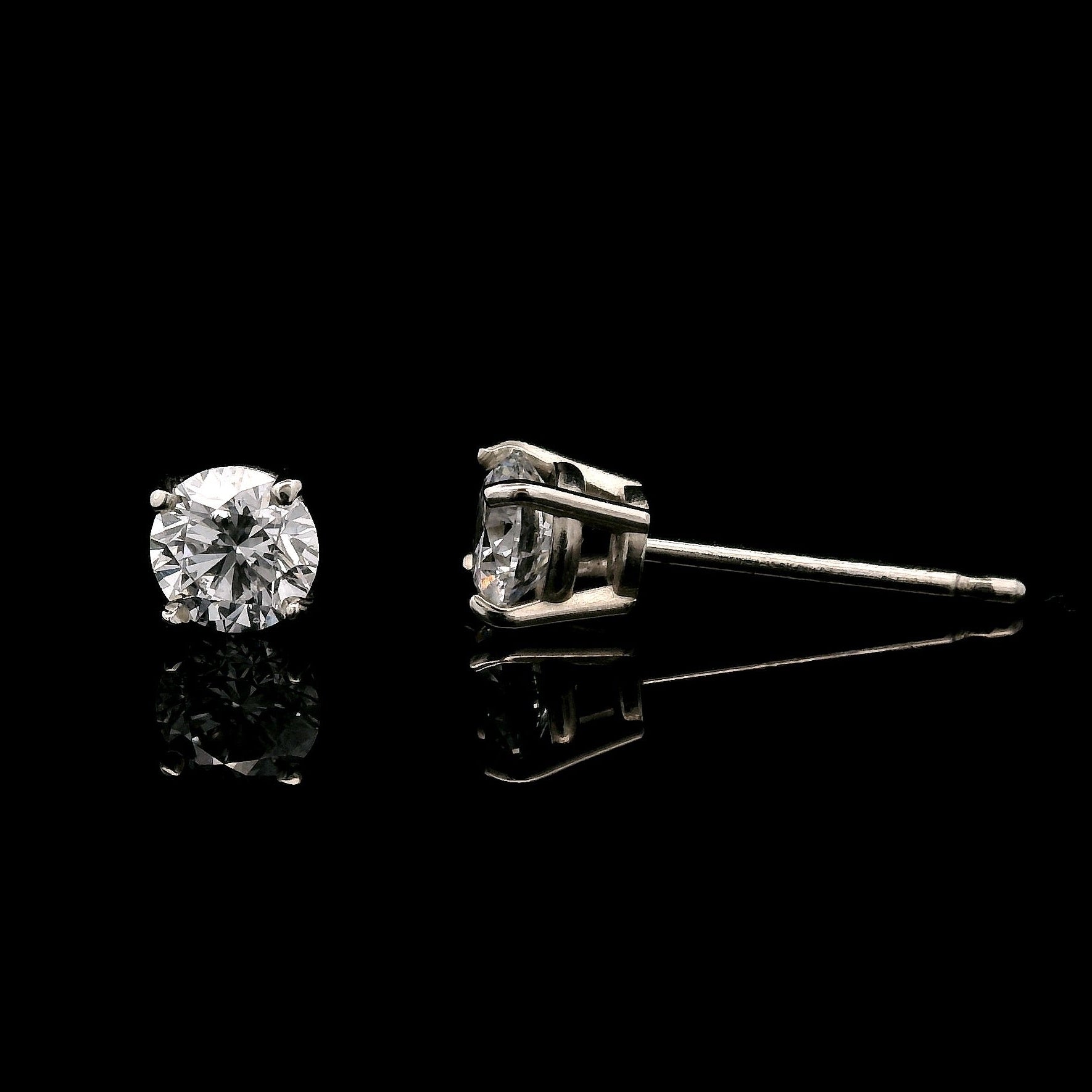 14K White gold stud earrings set with round brilliant diamonds. Item J34122 - ABC Jewelry Co.