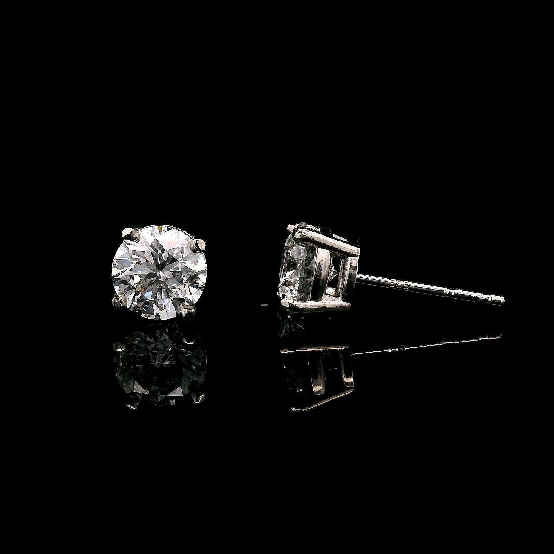 14K White gold stud earrings set with round brilliant diamonds. Item J34789 - ABC Jewelry Co.