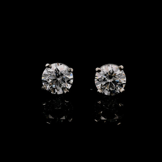 14K White gold stud earrings set with round brilliant diamonds. Item J34789 - ABC Jewelry Co.