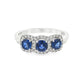18K White gold ring set with three deep blue sapphires, each surrounded by diamond halo. Item J35620 - ABC Jewelry Co.