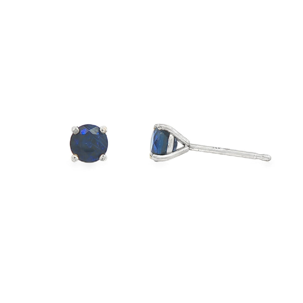 14K White gold stud earrings set with round blue sapphires. Item J35737 - ABC Jewelry Co. 