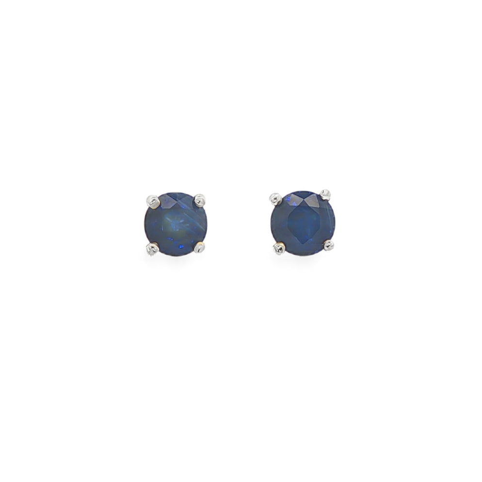 14K White gold stud earrings set with round blue sapphires. Item J35737 - ABC Jewelry Co. 