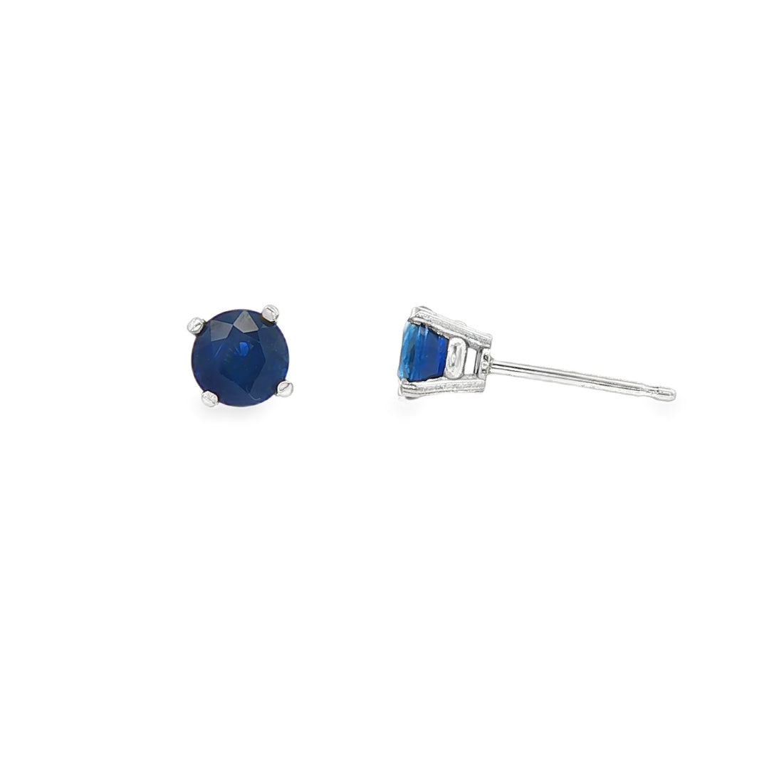14K White gold stud earrings set with round blue sapphires. Item J35737 - ABC Jewelry Co. 