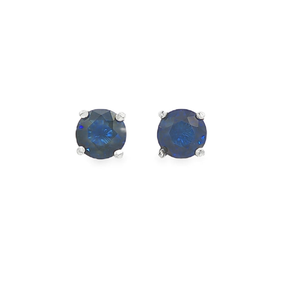 14K White gold stud earrings set with blue sapphires. Item J35740 - ABC Jewelry Co.