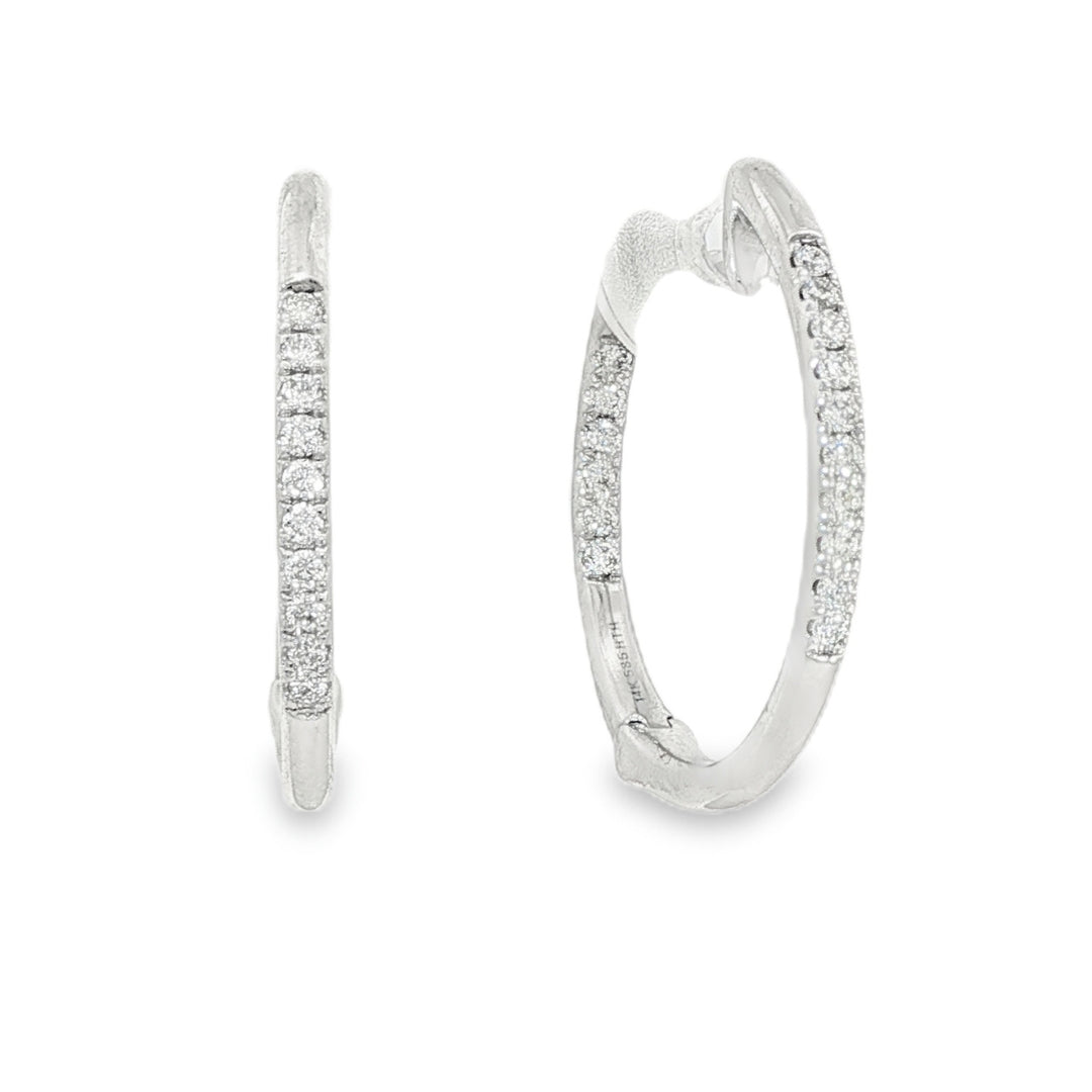 14K White gold hoop earrings accented with a row of round brilliant diamonds. Item J35835 - ABC Jewelry Co. 