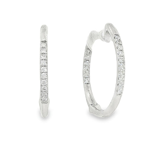 14K White gold hoop earrings accented with a row of round brilliant diamonds. Item J35835 - ABC Jewelry Co. 