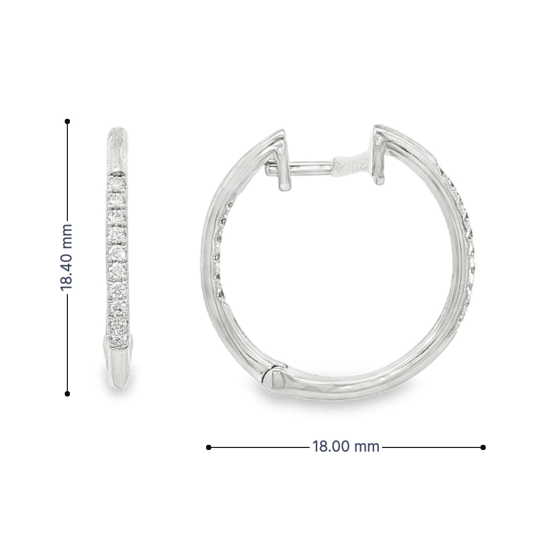14K White gold hoop earrings accented with a row of round brilliant diamonds. Item J35835 - ABC Jewelry Co. 