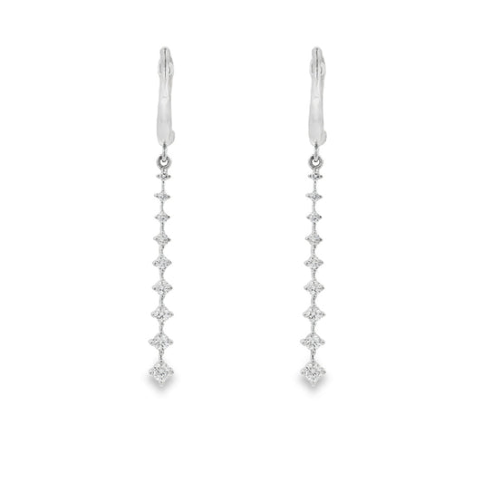 18K White gold dangle earrings with a vertical cascade of round brilliant diamonds. Item J36006 - ABC Jewelry Co