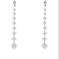 18K White gold dangle earrings with a vertical cascade of round brilliant diamonds. Item J36006 - ABC Jewelry Co