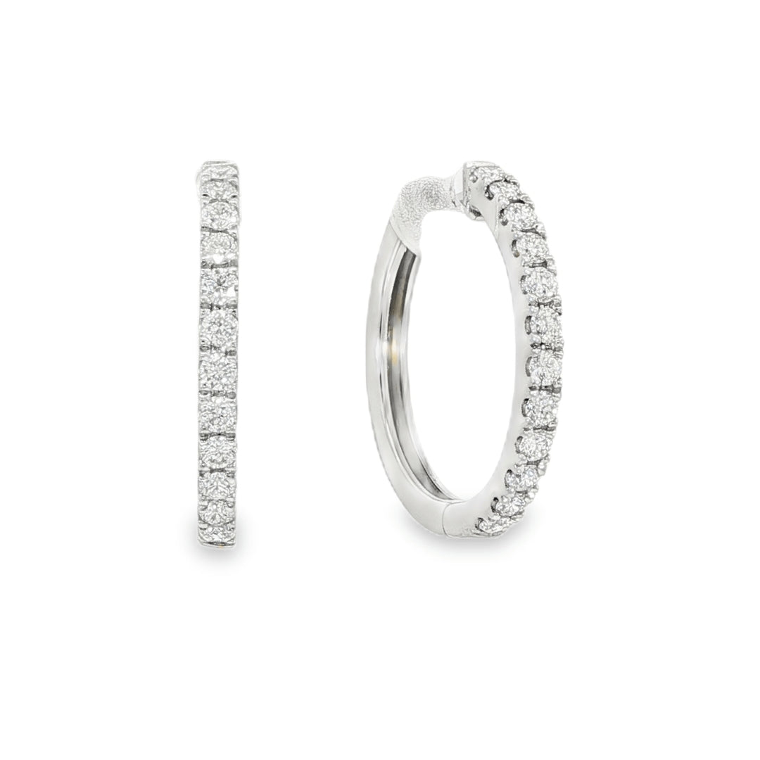 18K White gold hoop earrings set with a row of round brilliant diamonds. Item J36133 - ABC Jewelry Co. 