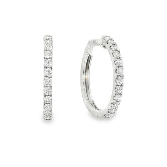 18K White gold hoop earrings set with a row of round brilliant diamonds. Item J36133 - ABC Jewelry Co. 
