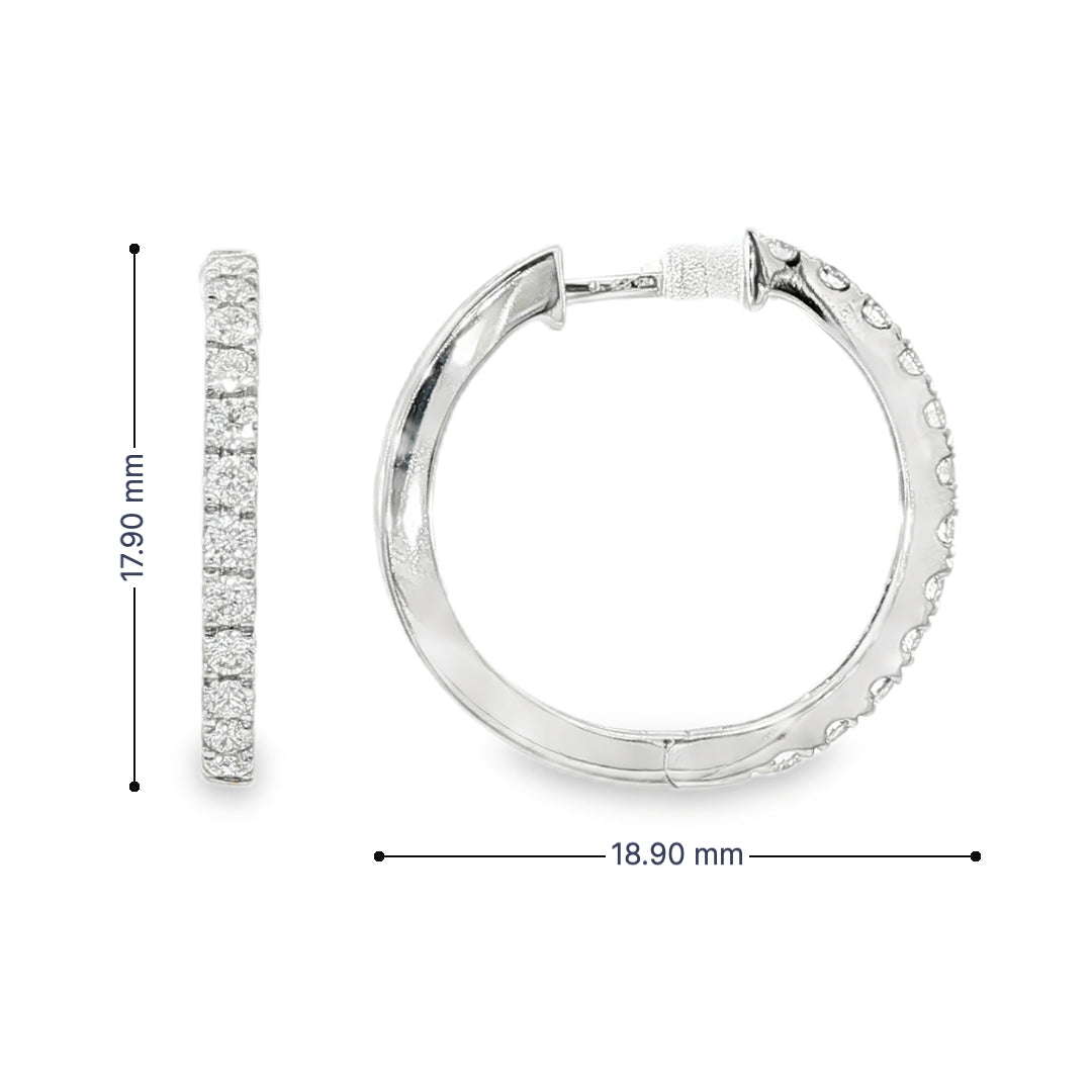 18K White gold hoop earrings set with a row of round brilliant diamonds. Item J36133 - ABC Jewelry Co. 