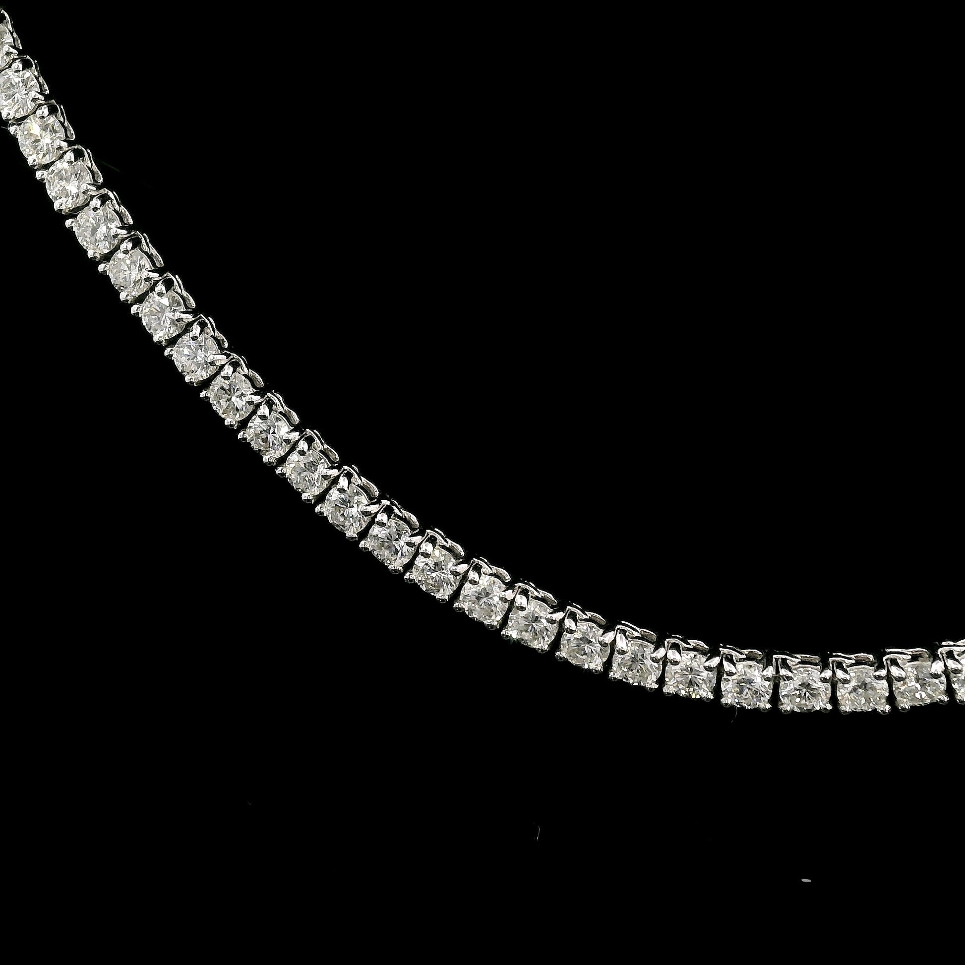18K White gold tennis necklace set with round brilliant diamonds. Item J36278 - ABC Jewelry Co.