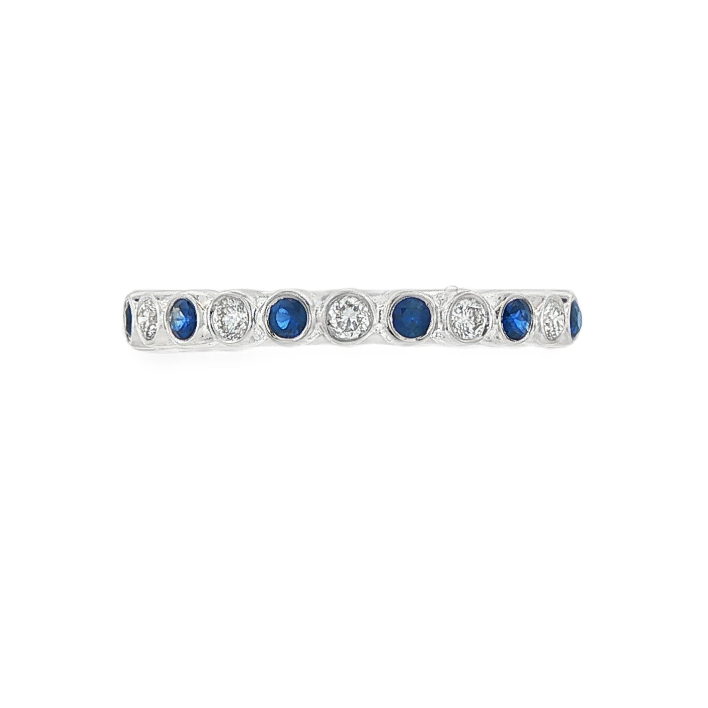 18K White gold band bezel set with alternating diamonds and blue sapphires. Item J36377 - ABC Jewelry Co. 
