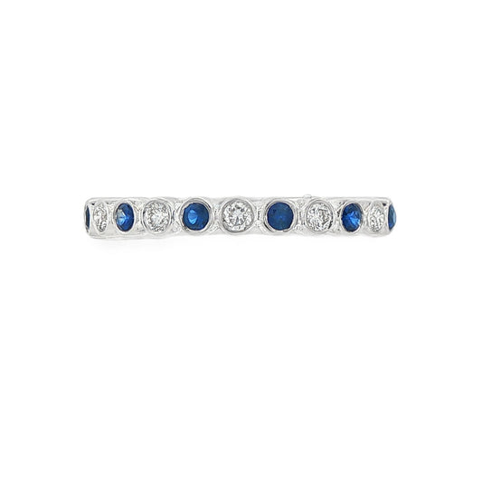 18K White gold band bezel set with alternating diamonds and blue sapphires. Item J36377 - ABC Jewelry Co. 