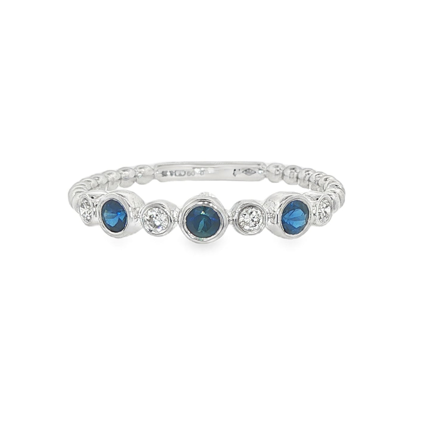 18K White gold band bezel set with blue sapphires and round brilliant diamonds. Item J36395 - ABC Jewelry Co. 