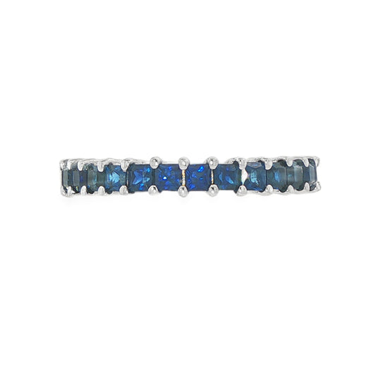 14K White gold eternity band set with princess cut blue sapphires. Item J36403 - ABC Jewelry Co.
