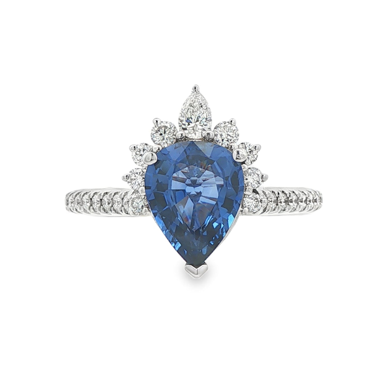 18K White gold ring set with a pear shape blue sapphire crowned with diamonds. Item J36871 - ABC Jewelry Co. 