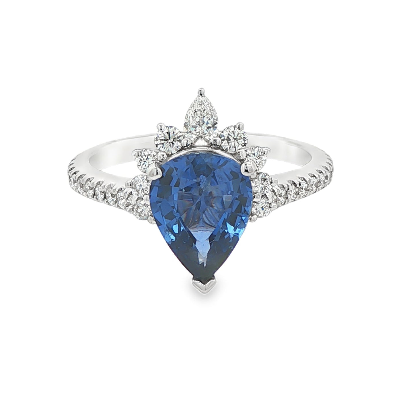 18K White gold ring set with a pear shape blue sapphire crowned with diamonds. Item J36871 - ABC Jewelry Co. 