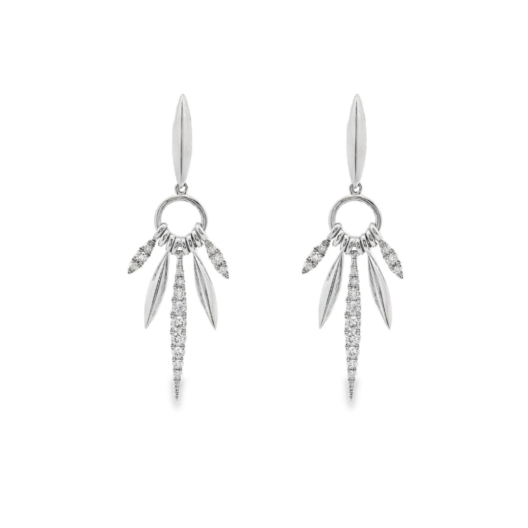18K White gold earrings with marquise inspired drops set with round brilliant diamonds. Item J36882 - ABC Jewelry Co