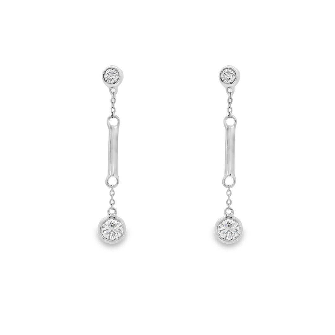 18K White gold dangle earrings with bezel set round brilliant diamonds. Item J36883 - ABC Jewelry Co. 