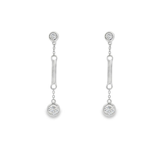 18K White gold dangle earrings with bezel set round brilliant diamonds. Item J36883 - ABC Jewelry Co. 