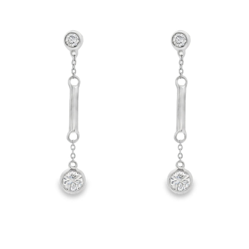 18K White gold dangle earrings with bezel set round brilliant diamonds. Item J36883 - ABC Jewelry Co. 