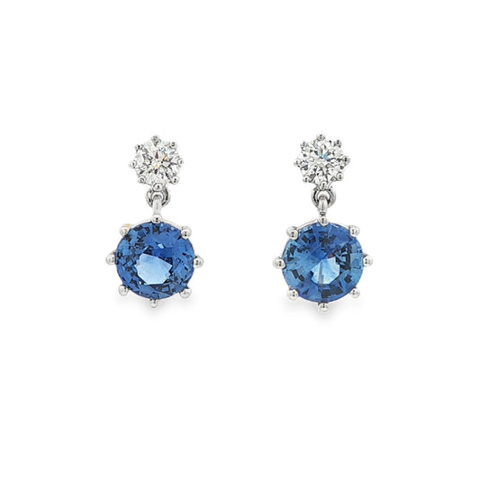14K White gold drop earrings set with blue sapphires and round brilliant diamonds. Item J37495 - ABC Jewelry Co.