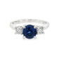 18K White gold ring set with one round blue sapphire and two round brilliant diamonds. Item J37692 - ABC Jewelry Co. 