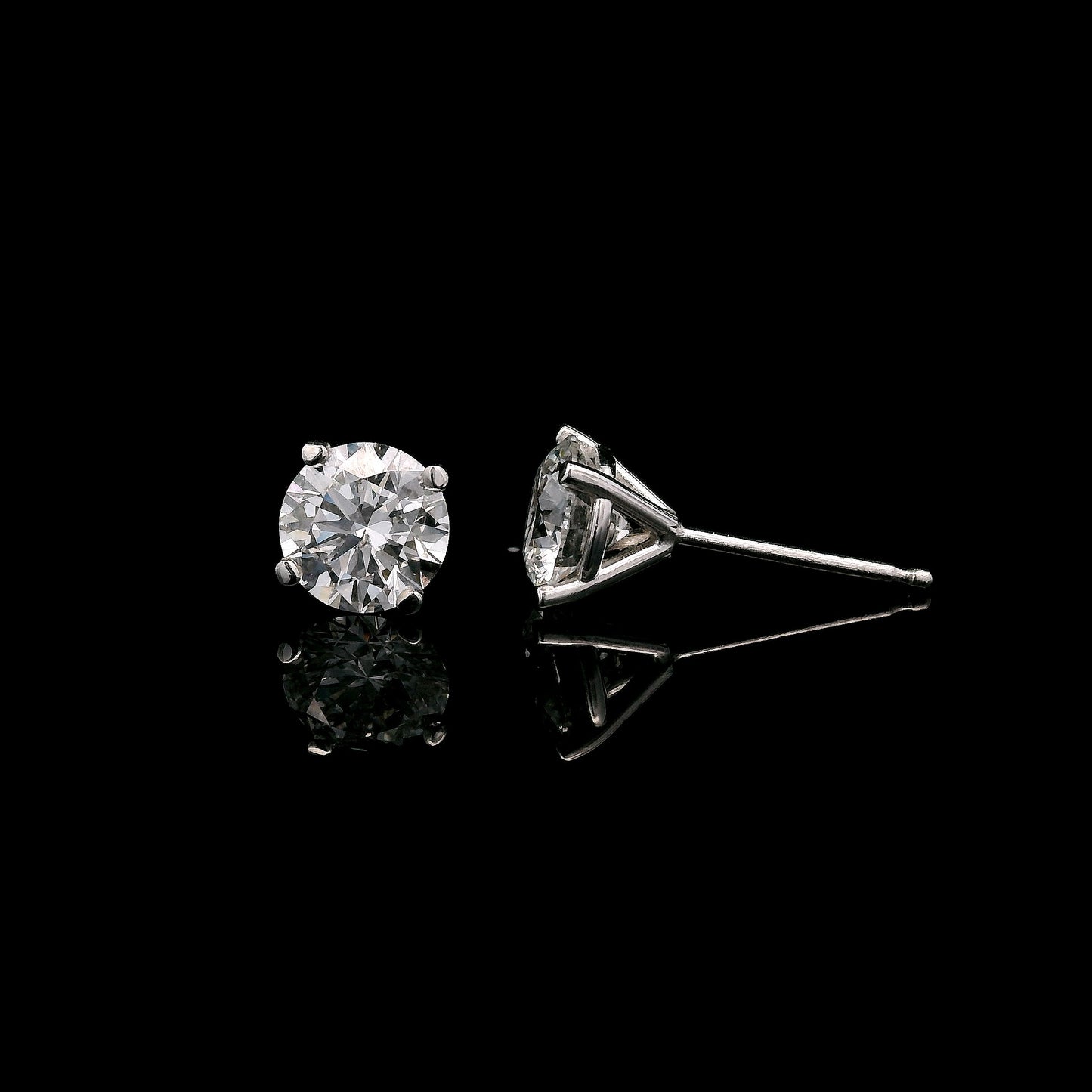 14K White gold stud earrings set with round brilliant diamonds. Item J37751 - ABC Jewelry Co.