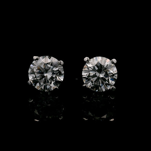 14K White gold stud earrings set with round brilliant diamonds. Item J37751 - ABC Jewelry Co.
