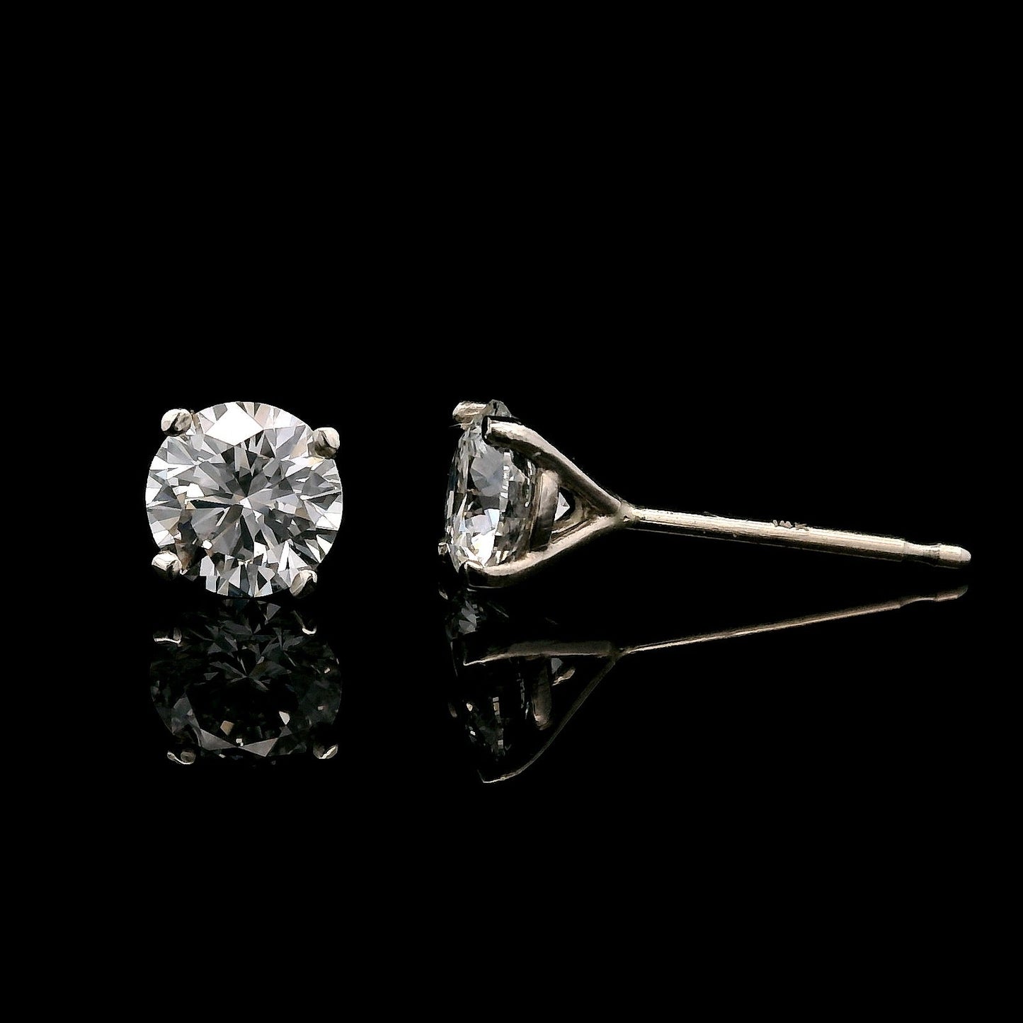 14K White gold stud earrings set with round brilliant diamonds. Item J37804 - ABC Jewelry Co.