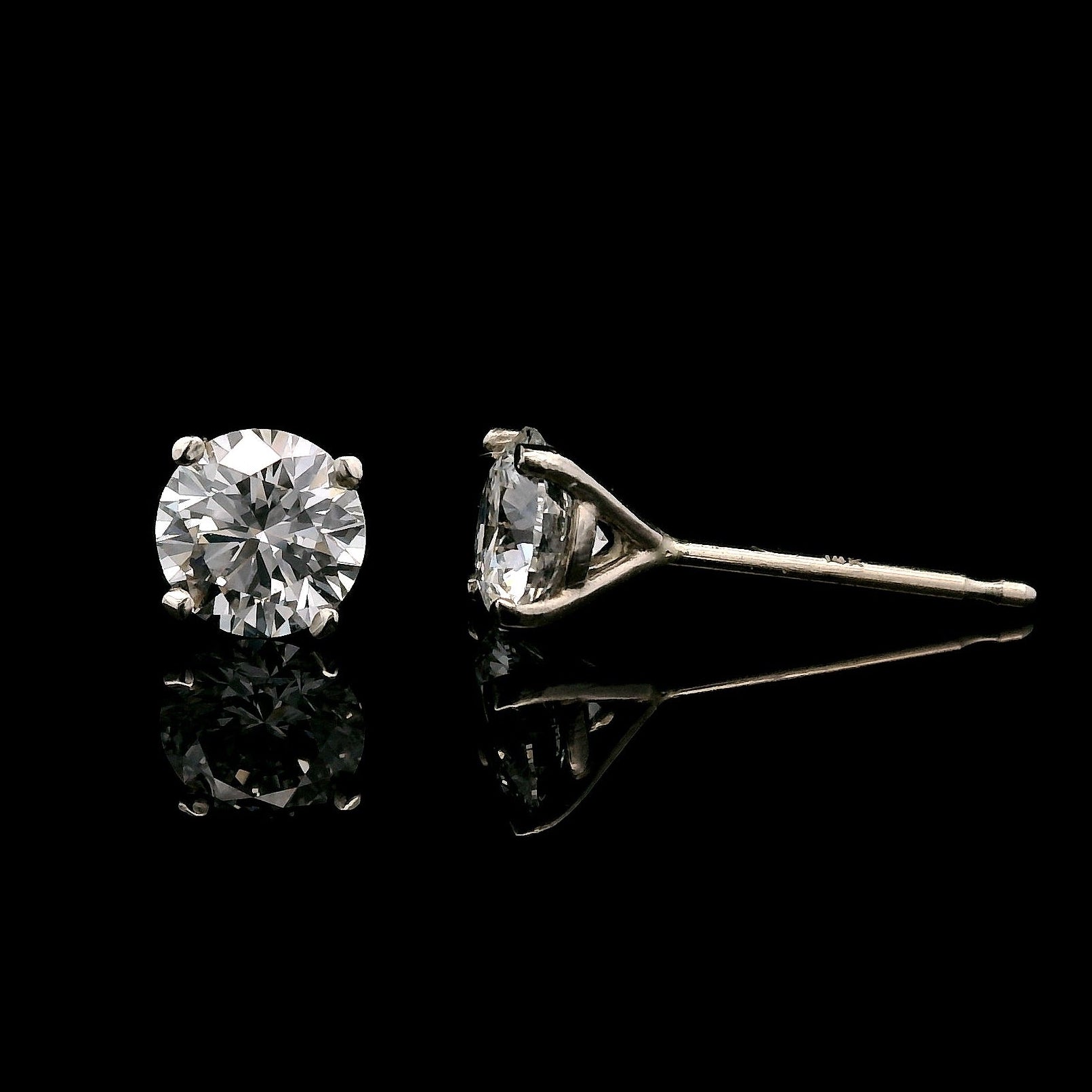 14K White gold stud earrings set with round brilliant diamonds. Item J37804 - ABC Jewelry Co.