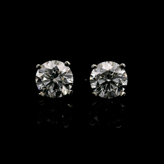 14K White gold stud earrings set with round brilliant diamonds. Item J37810 - ABC Jewelry Co.