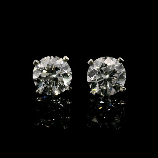 14K White gold stud earrings set with round brilliant diamonds. Item J37811 - ABC Jewelry Co.